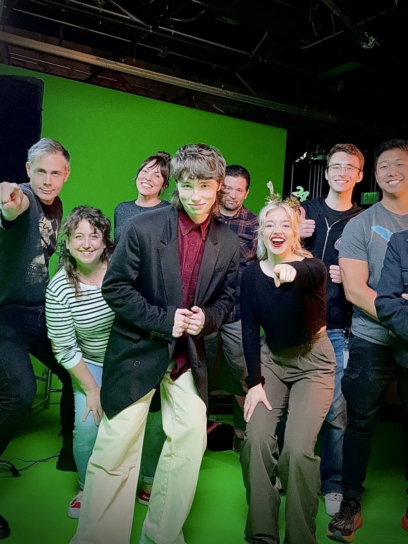 The Nick News crew on a green screen stage